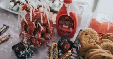 A delightful assortment of candies, chocolates, and cookies on a table, perfect for indulgence.