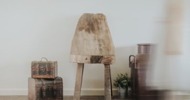 brown wooden table beside two luggage bags