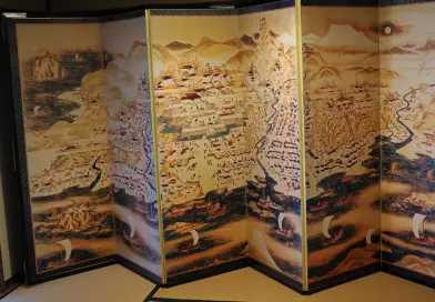 Antique map art is depicted on a folding screen.